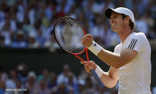 Andy Murray of Britain celebrates during the men's singles final with Novak Djokovic of Serbia on day 13 of the Wimbledon Lawn Tennis Championships at the All England Lawn Tennis and Croquet Club in London, Britain, July 7, 2013. Andy Murray on Sunday won his first Wimbledon title and ended Britain's 77-year wait for a men's champion with a 6-4 7-5 6-4 victory over world number one Novak Djokovic. (Xinhua/Wang Lili) 