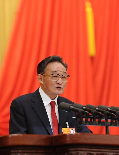 Wu Bangguo delivers a work report of the Standing Committee of the National People's Congress (NPC) during the second plenary meeting of the first session of the 12th NPC at the Great Hall of the People in Beijing, capital of China, March 8, 2013. (Xinhua/Xie Huanchi)