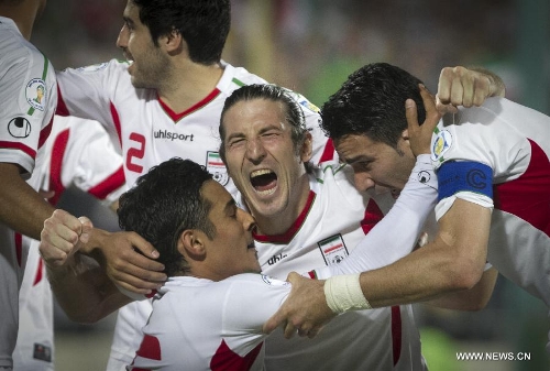 Players of Iran celebrate a goal during their 2014 World Cup Qualification Asia match against Lebanon at Azadi stadium in Tehran, Iran, June 11, 2013. Iran won 4-0. (Xinhua/Ahmad Halabisaz) 