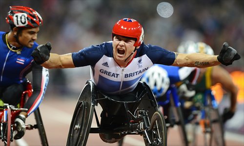 David Weir celebrates after winning the gold medal in the men's 1,500m T54 final on Tuesday. Photo: AFP