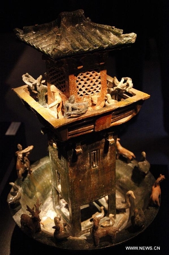 A Chinese terracotta tower is on display at the 58th Brussels Antiques & Fine Arts Fair (BRAFA) in Brussels, Belgium, Jan. 19, 2013. A total of 128 antique and fine art dealers from across the world will showcase their most precious pieces of art during the one-week fair. (Xinhua/Wang Xiaojun) 