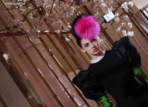 A model presents a creation by French fashion designer Christian Lacroix for Italian fashion house Elsa Schiaparelli in Paris, France, July 1, 2013. (Xinhua/Gao Jing) 