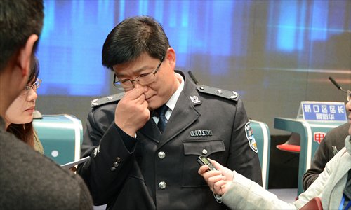 Li Shunnian, traffic bureau chief in Wuhan, Hubei Province, is caught in a media scum after he was embarrassed on a television program that showed he had failed to fix traffic congestion in the city. Photo: CFP