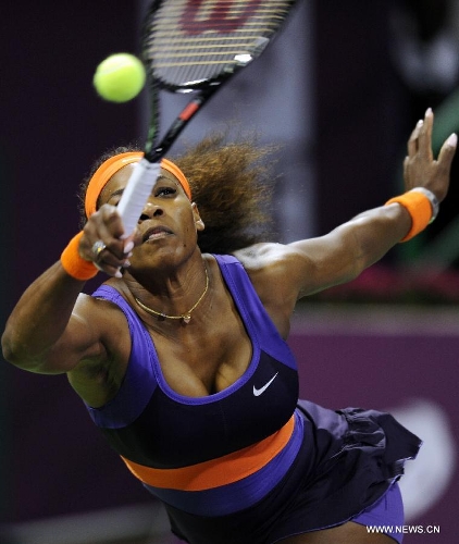 Serena Williams of the United States returns a shot during the women's semifinal against Maria Sharapova of Russia at the Qatar Open tennis tournament in Doha, capital of Qatar, Feb. 16, 2013. Serena Williams won 2-0. (Xinhua/Chen Shaojin) 