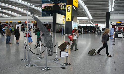 A life-size wire sculpture of diver Tom Daley designed by Nikki Taylor on display at Heathrow Airport's Terminal 5 departures lounge on August 16, 2011 in London, England. Photo: CFP