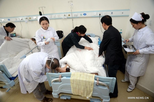 An injured worker is treated at the hospital of the Xinyu Iron and Steel Group Company after a furnace explosion in Xinyu, east China's Jiangxi Province, April 1, 2013. A furnace exploded at 11:22 a.m. at the company on Monday, which killed four people and injured another 32. The injured have been hospitalized. (Xinhua/Song Zhenping) 