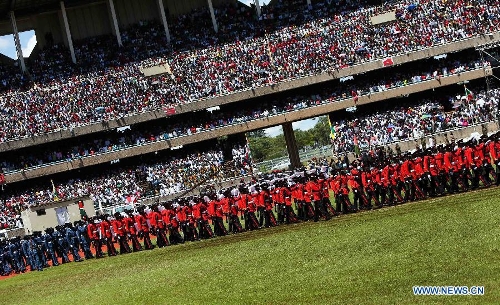 Honor guard attending Uhuru Kenyatta's inauguration ceremony walk into Moi International Sports Center in Nairobi, capital of Kenya, April 9, 2013. Kenya's President Uhuru Kenyatta officially took office on Tuesday after being sworn into office as the East African nation's fourth president. (Xinhua/Meng Chenguang)