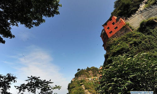 Photo taken on July 11, 2012 shows the scenery of Wudang Mountain in central China's Hubei Province. As the cradle of the Taoist culture, the Wudang Mountain was inscribed on the list of World Cultural Heritages in 1994. The scenery of the mountain attracts tens of thousands of visitors every year. Over 4 million tourists from at home and abroad are expected to visit the site this year. Photo: Xinhua