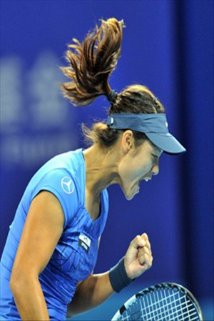 Li Na of China reacts during the women's singles 3rd round match against Peng Shuai of China at the China Open tennis tournament in Beijing China, on October. 4, 2012.  Photo: Xinhua