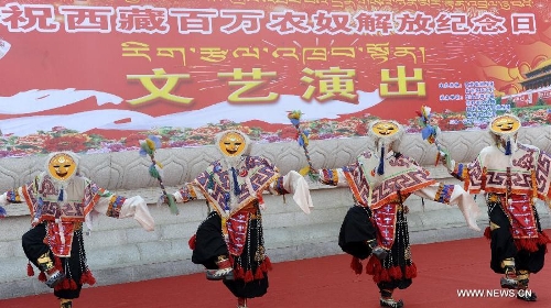 Folk artists give performance to mark the 54th anniversary of the abolishment of Tibet's feudal serfdom in Lhasa, capital of southwest China's Tibet Autonomous Region, March 28, 2013. Authorities have designated March 28 as the day to commemorate the 1959 democratic reform in Tibet, which ended the feudal serf system. The reform freed about 1 million Tibetans, over 90 percent of the region's population at the time, from a life of serfdom. (Xinhua/Chogo)