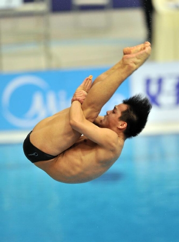 He Chong of China competes during the men's 3m springboard final at the FINA Diving World Series 2013 held at the Aquatics Center, in Beijing, capital of China, on March 16, 2013. He Chong took the 2nd place with 521.50 points. (Xinhua/Li Wen)