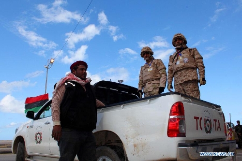 Securities patrol during a celebration for the second anniversary of the uprising that toppled the regime of strongman Muammar Gaddafi in Benghazi, on Feb. 17, 2013. (Xinhua/Mohammed El Shaiky) 