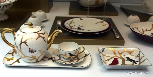 Photo taken on May 4, 2013 shows a set of classic tableware displayed in an exhibition of 