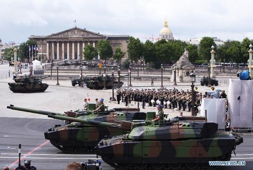 French soldiers attend the annual Bastille Day military parade in Paris, France, July 14, 2012. Under grey sky of a windy day, French President Francois Hollande celebrated his first-ever National Day (known outside of France as Bastille Day) as head of state on Saturday with usual pomp, military parade and flight show. Photo: Xinhua