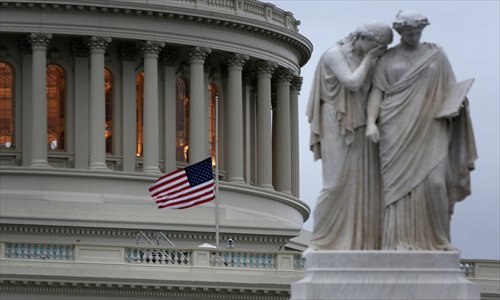 A US flag flies at half mast on the US Capitol Monday on Capitol Hill in Washington, DC. At least three people were killed in two explosions at the Boston Marathon Monday. Photo: AFP