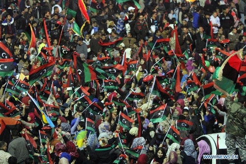  People gather to enjoy the fireworks during a celebration for the second anniversary of the Libyan uprising at the Martyrs' Square in Tripoli on Feb. 17, 2013. (Xinhua/Hamza Turkia) 