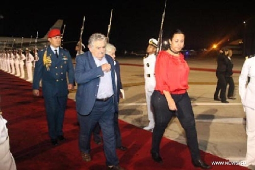  Image provided by People's Ministry of Foreign Affairs of Venezuela, shows Uruguayan President Jose Mujica (C) arriving at Caracas city, capital of Venezuela, on March 6, 2013. Venezuelan President Hugo Chavez died of cancer on Tuesday. (Xinhua/People's Ministry of Foreign Affairs of Venezuela) 