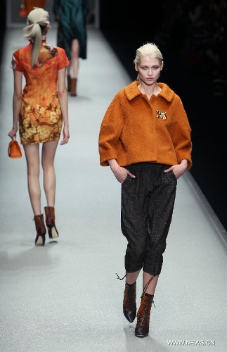 Models present creations by designer Shiatzy Chen from China's Taiwan as part of her Fall-Winter 2013/2014 women's ready-to-wear fashion collection during Paris Fashion Week, in Paris, France, March 5, 2013. (Xinhua/Gao Jing)  