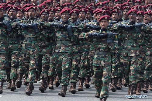 Sri Lankan army personnel march during the Victory Day parade in Colombo, Sri Lanka, May 18, 2013. Sri Lanka on Saturday celebrated the fourth anniversary of the defeat of the Tamil Tiger rebels after 30 years of war. (Xinhua/Pushpika Karunaratne) 