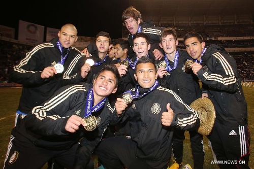 Mexico's players celebrate after the awarding ceremony of CONCACAF Under-20 Championship Grand Final soccer match against U.S., held at Cuauhtemoc Stadium in Puebla, Mexico, on March 3, 2013. (Xinhua/Straffonimages) 