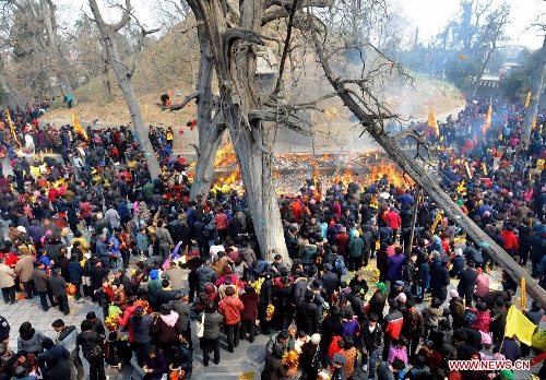  People gather to commemorate Fu Hsi, a legnedary emperor of China who is regarded as an ancestor of Chinese civilization in Huaiyang County, central China's Henan Province, March 17, 2010. The central China region is regarded as the birthplace of Chinese civilization and people here have a tradition to attend the memorials to commemorate ancestors to pray for good fortune in the new year. Chinese people who live in the central China region have formed various traditions to celebrate the Chinese Lunar New Year. (Xinhua/Wang Song)