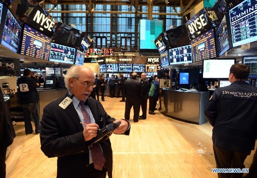 Traders work on the floor of the New York Stock Exchange on March 6, 2013. U.S. stocks surged on Tuesday, with the Dow Jones Industrial Average setting all-time closing high and intra-day high, as investors became more confident in the stock market. (Xinhua/Wang Lei) 