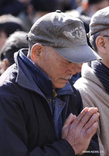 People attend a mourning ceremony in Tokyo, capital of Japan, on March 11, 2013. A mourning ceremony was held here Monday to mark the two year anniversary of the March 11 earthquke and ensuing tsunami that left more than 19,000 people dead or missing and triggered a nuclear accident the world had never seen since 1986. (Xinhua/Kenichiro Seki) 