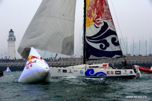 China's Guo Chuan passes a finish buoy on his boat in Qingdao, east China's Shandong Province, April 5, 2013. Guo sailed back home on Friday morning to become the first Chinese to successfully circumnavigate the globe singlehanded. Aboard his Class40 yacht, 48-year-old Guo travelled about 21,600 nautical miles in 138 days before he returned to his hometown of Qingdao, where he set off on November 18 last year. (Xinhua/Li Ziheng) Related:Guo Chuan dedicates successful solo non-stop sail around world to late fatherQINGDAO, Shandong Province, April 5 (Xinhua) -- Chinese sailor Guo Chuan paid homage to his late father after he successfully completed a non-stop solo travel around the world on Friday.