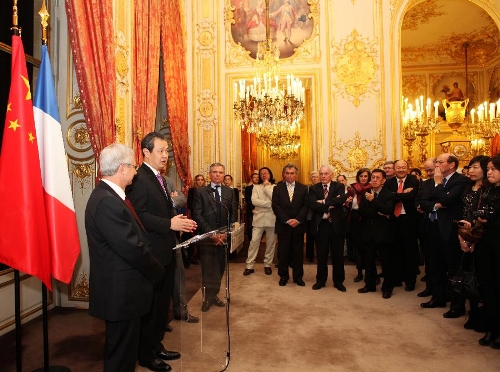 Chinese Ambassador to France Kong Quan (2nd L) addresses a Chinese lunar New Year reception at the residence of the speaker of France's National Assembly in Paris, capital of France, on Feb. 5, 2013. The Chinese Embassy to France and the France-China Friendship Group of France's National Assembly held the reception here on Tuesday to greet the upcoming Chinese lunar New Year, which falls on Feb. 10 this year. (Xinhua/Gao Jing) 