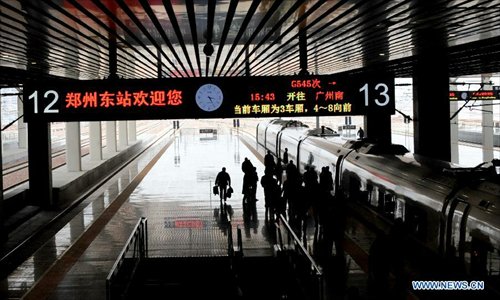 A high-speed train leaves the Zhengzhou East Railway Station in Zhengzhou, capital of central China's Henan Province, December 18, 2012. The Beijing-Zhengzhou high-speed railway will start service on December 26, connecting the functioning Zhengzhou-Wuhan and Wuhan-Guangzhou high-speed railway to become the world's longest high-speed railway. The new station is the biggest high-speed railway marshalling station of central China as well as a comprehensive passenger tranportation hub incorporating high-speed railway, road transportation, intercity railway, subway and bus. Photo: Xinhua