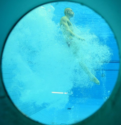 Ilya Zakharov of Russia competes during the men's 3m springboard final at the FINA Diving World Series 2013 held at the Aquatics Center, in Beijing, capital of China, on March 16, 2013. Ilya Zakharov took the third place with 514.45 points. (Xinhua/Guo Yong)