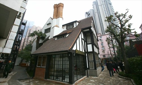 Visitors tour Hungarian architect L.E. Hudec's (1893-1958) memorial hall, which opened at his former residence on Panyu Road in Xuhui district Tuesday. Hudec came to Shanghai in 1918 and was involved in designing more than 60 local buildings in the 1920s and 1930s, including the Park Hotel, the Grand Cinema and the Paramount Hall. Photo: Cai Xianmin/GT