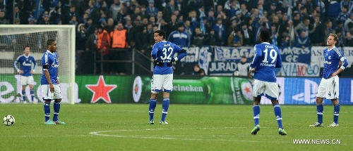 Players of FC Schalke 04 react after the UEFA Champions League eighth-final match against Galatasaray at Veltins Arena in Gelsenkirchen, west Germany, March 12, 2013. Galatasaray won 3-2 and entered the quarterfinal. (Xinhua/Ma Ning) 