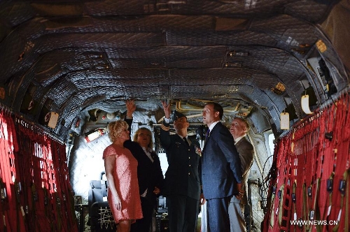 Canadian Defense Minister Peter MacKay (R) inspects the inside of a new CH-147F Chinook helicopter during the unveiling ceremony in Ottawa June 27, 2013. The 15 newly purchased F-model Chinooks will be engaged in support, domestic and foreign operations for the Royal Canadian Air Force's reactivated 