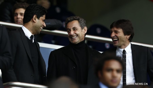 Paris Saint-Germain club's chairman Nasser Al-Khelaifi(L) talks with former French President Nicolas Sarkozy (C) ahead of a French League 1 football match between Paris St Germain and Brest at Parc des Princes stadium in Paris on May 18, 2013. Paris Saint-Germain won 3-1. (Xinhua/Wang Lili)