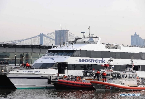  Rescue teams work at the accident site where a ferry boat crashed into Pier 11 in lower Manhattan, New York, the United States, on Jan. 9, 2013. A high-speed ferry loaded with hundreds of commuters from New Jersey crashed into a dock near Wall Street on Wednesday during the morning rush hour, injuring 57 people. (Xinhua/Shen Hong) 