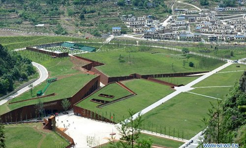 Photo taken on May 9, 2013 shows the crack-shaped Wenchuan Earthquake Memorial Museum in the town of Qushan, Beichuan Qiang Autonomous County, southwest China's Sichuan Province, May 9, 2013. The museum was officially opened to the public for free on Thursday to commemorate the fifth anniversary of the Wenchuan earthquake, which hit Sichuan on May 12, 2008 and left more than 87,000 people dead or missing. (Xinhua/Xue Yubin) 