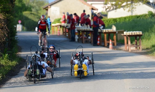 Competitors participate in the Half Marathon Handbike and armchair race during the 9th Geneva Marathon in Geneva, Switzerland, May 5, 2013. Swiss wheelchair athlete Heinz Frei claimed the title with 35:53:03. (Xinhua/Wang Siwei) 