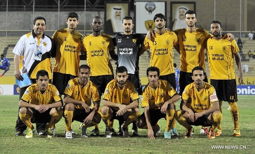 Players of Kuwait's Qadsia SC pose for a group photo before the AFC Cup football match against Tajikistan's Ravshan SC in Kuwait City, Kuwait, on April 3, 2013. Qadsia won the match 3-0. (Xinhua/Noufal Ibrahim) 