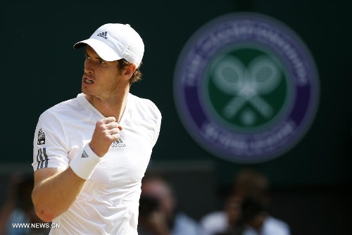  Andy Murray of Britain celebrates during the men's singles final with Novak Djokovic of Serbia on day 13 of the Wimbledon Lawn Tennis Championships at the All England Lawn Tennis and Croquet Club in London, Britain, July 7, 2013. Andy Murray on Sunday won his first Wimbledon title and ended Britain's 77-year wait for a men's champion with a 6-4 7-5 6-4 victory over world number one Novak Djokovic. (Xinhua/Wang Lili) 