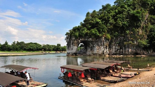 Photo taken on July 31, 2011 shows the landscape scenery of the Xiangbi Mountain in Guilin, south China's Guangxi Zhuang Autonomous Region. Guilin, a famous tourist resort, boasts various Karst land features. (Xinhua/Mu Yi) 