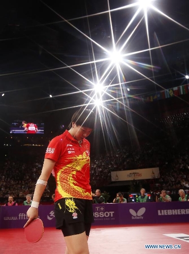  Li Xiaoxia of China reacts after winning the final of women's singles against her teammate Liu Shiwen at the 2013 World Table Tennis Championships in Paris, France on May 19, 2013. Li won 4-2 to claim the title. (Xinhua/Wang Lili) 