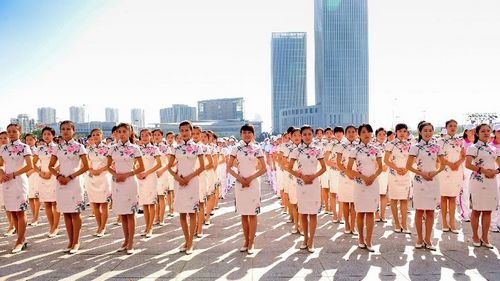 Volunteers attend an inauguration ceremony before the sixth Annual Meeting of the New Champions in Tianjin, North China, September 5, 2012. The sixth Annual Meeting of the New Champions, also known as the Summer Davos Forum, will be held in Tianjin on September 11, 2012. Photo: Xinhua

