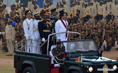 Sri Lankan president Mahinda Rajapaksa (C) inspects a Victory Day parade in Colombo, Sri Lanka, May 18, 2013. Sri Lanka on Saturday celebrated the fourth anniversary of the defeat of the Tamil Tiger rebels after 30 years of war. (Xinhua/Pushpika Karunaratne) 