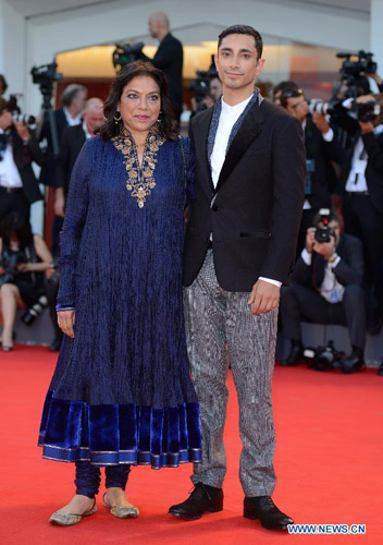 Indian director Mira Nair (L) and actor Riz Ahmed pose on the red carpet of the Venice Film Festival in Venice, Italy, August 29, 2012. The 69th Venice International Film Festival opened here late Wednesday. Photo: Xinhua