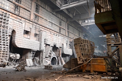 Debris is seen at the site of a furnace explosion at the Xinyu Iron and Steel Group Company in Xinyu City, east China's Jiangxi Province, April 1, 2013. A furnace exploded at 11:22 a.m. at the company on Monday, which killed four people and injured another 32. The injured have been hospitalized. (Xinhua/Song Zhenping) 