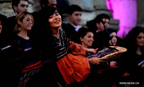 Performers participate in the opening ceremony of Jordan's annual Jerash Festival, hosted in the ancient Greco-Roman city, 45 km north of Amman, on June 26, 2013. (Xinhua/Mohammad Abu Ghosh) 