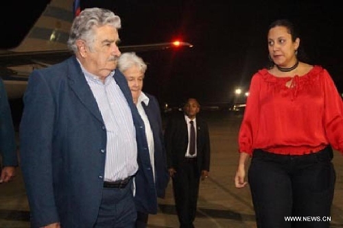  Image provided by People's Ministry of Foreign Affairs of Venezuela, shows Uruguayan President Jose Mujica (L) arriving at Caracas city, capital of Venezuela, on March 6, 2013. Venezuelan President Hugo Chavez died of cancer on Tuesday. (Xinhua/People's Ministry of Foreign Affairs of Venezuela)