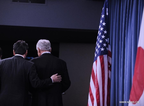 U.S. Defense Secretary Chuck Hagel (R) leaves after a press conference with his Japanese counterpart Itsunori Onodera following their meeting at the Pentagon in Washington D.C., capital of the United States, April 29, 2013. (Xinhua/Wang Yiou) 