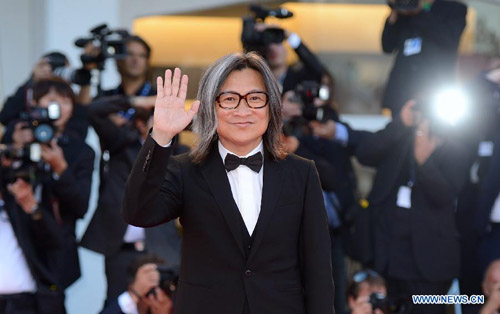 Chinese Hong Kong director Peter Chan Ho-sun, jury member of the main competition section, poses on the red carpet of the Venice Film Festival in Venice, Italy, August 29, 2012. The 69th Venice International Film Festival opened here late Wednesday. Photo: Xinhua